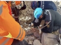 Armenian rescuers bring out an 8-year-old girl alive from the rubble in Turkey